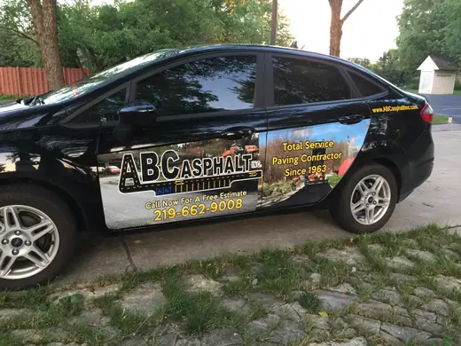 Black car with full-color side graphics