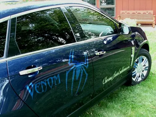 Dark blue car with light blue side graphics